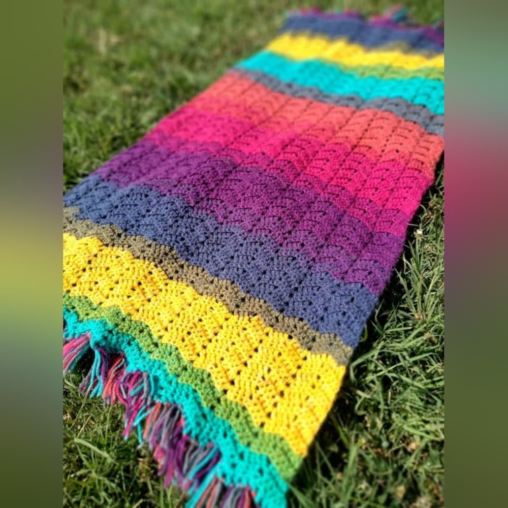 Handcrafted rainbow blanket with fringe